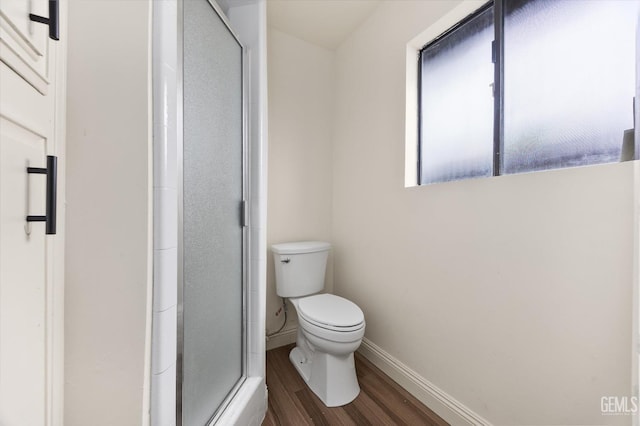 2904 Brock Way, Bakersfield, CA 93306 - bathroom with baseboards, wood finished floors, a shower stall, and toilet