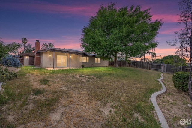 2904 Brock Way, Bakersfield, CA 93306 - yard at dusk featuring a fenced backyard