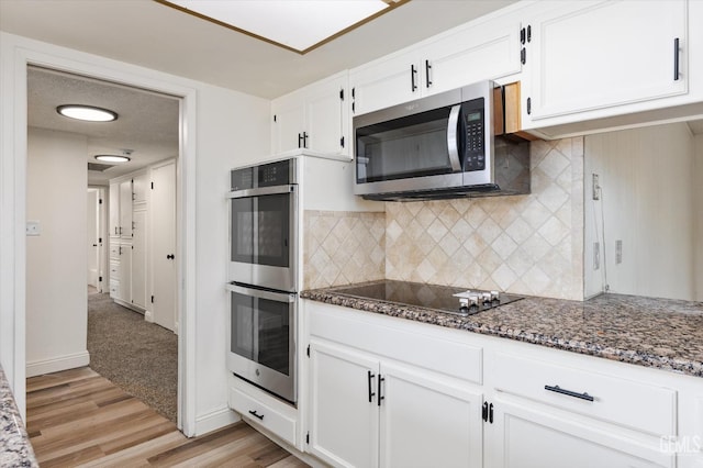 2904 Brock Way, Bakersfield, CA 93306 - kitchen featuring dark stone counters, white cabinetry, tasteful backsplash, appliances with stainless steel finishes, and light wood finished floors