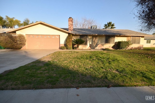 ranch-style home with a garage and a front yard