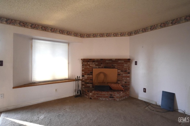 unfurnished living room featuring a textured ceiling, carpet floors, and a brick fireplace