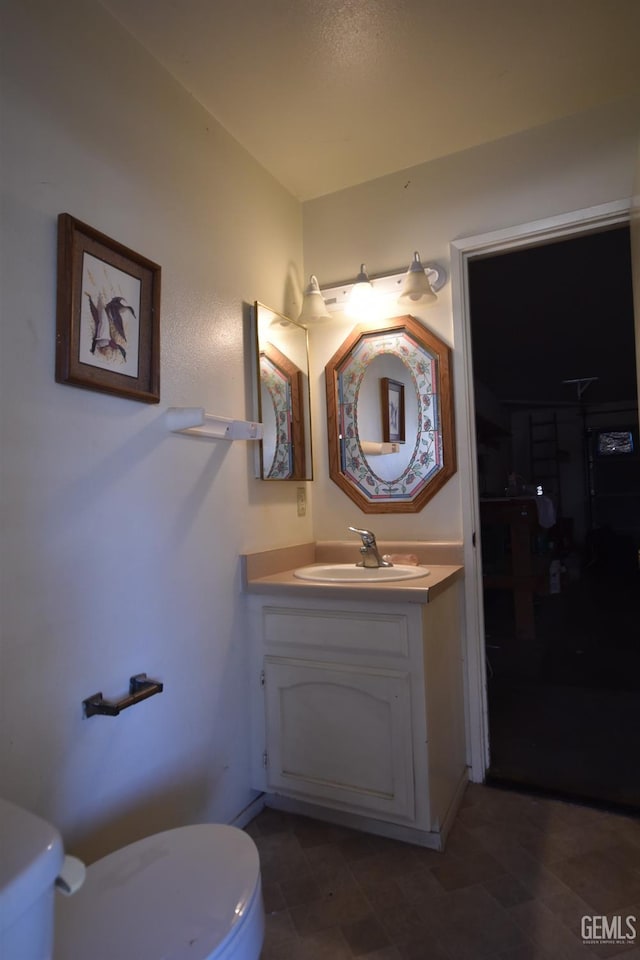 bathroom with vanity and toilet