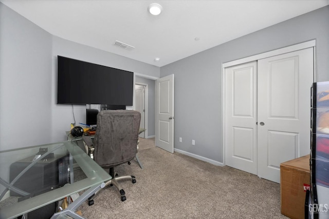 home office with light carpet and baseboards