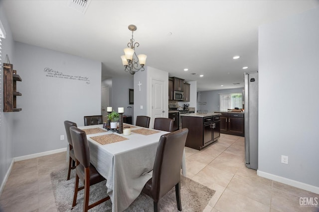 dining room featuring a chandelier, light tile patterned floors, baseboards, and recessed lighting