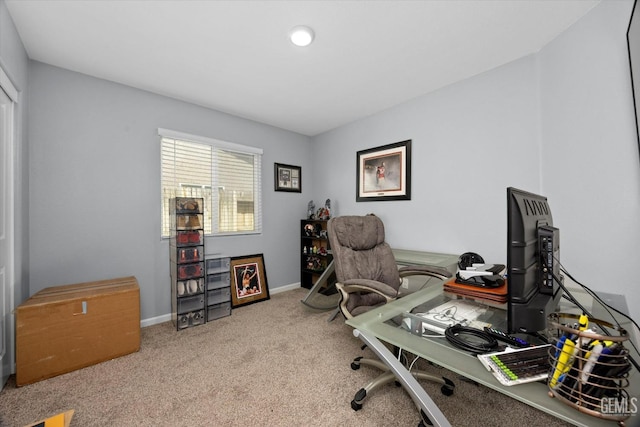 carpeted office with baseboards