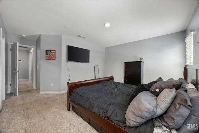 bedroom featuring carpet floors and baseboards