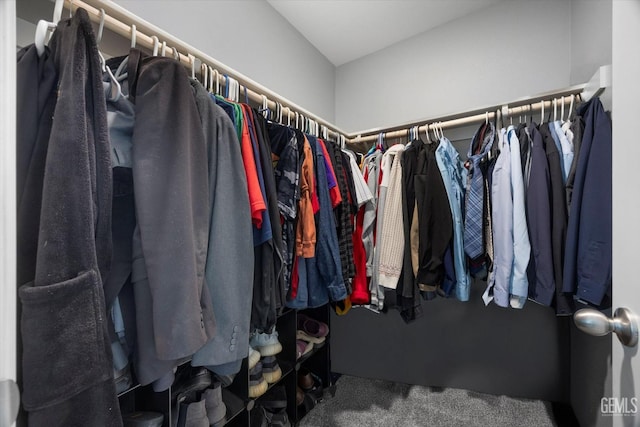 walk in closet featuring carpet