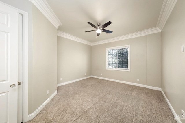 spare room with ceiling fan, light carpet, and ornamental molding