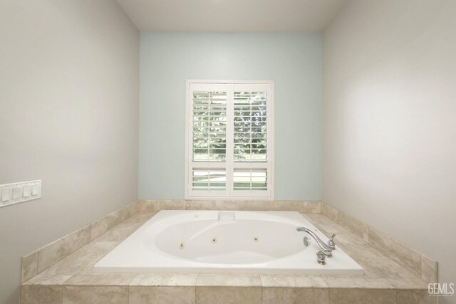 bathroom featuring tiled bath