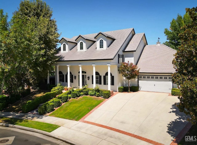 view of front facade with a front yard and a garage