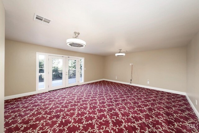 unfurnished room with french doors