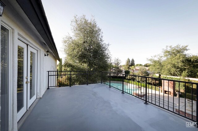 balcony featuring a patio area and french doors