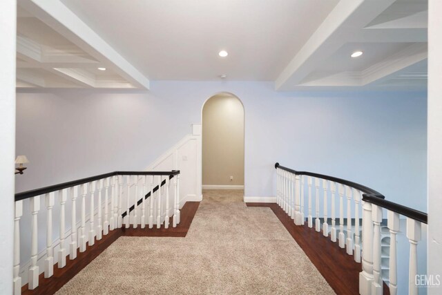 hallway featuring beamed ceiling and coffered ceiling