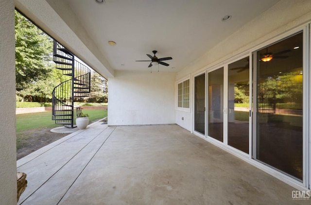 view of patio featuring ceiling fan