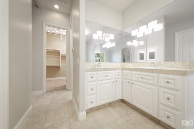 bathroom with tile patterned floors and vanity