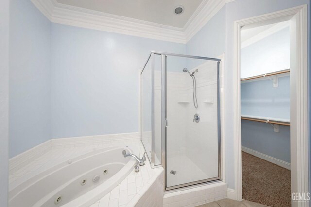 bathroom featuring separate shower and tub and crown molding