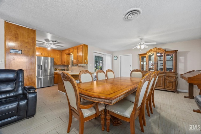 4501 Chadbourn St, Bakersfield, CA 93307 - dining area featuring a ceiling fan and a textured ceiling