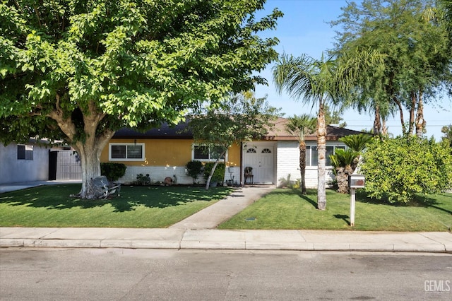 4501 Chadbourn St, Bakersfield, CA 93307 - ranch-style home featuring a front lawn