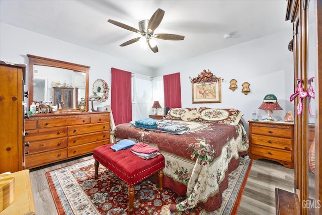 bedroom featuring ceiling fan and light hardwood / wood-style flooring