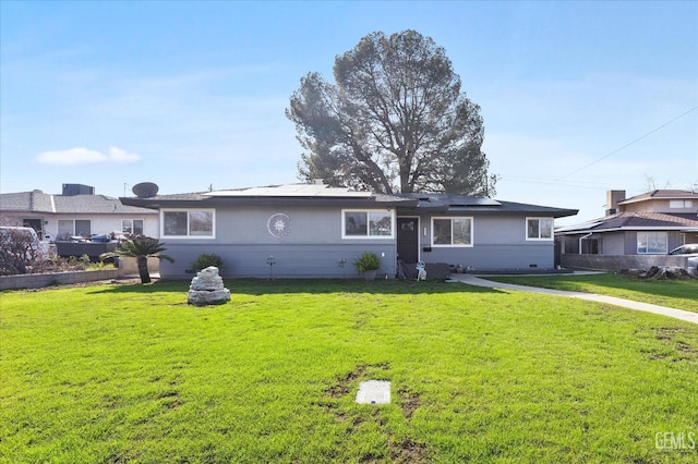 ranch-style home featuring a front yard