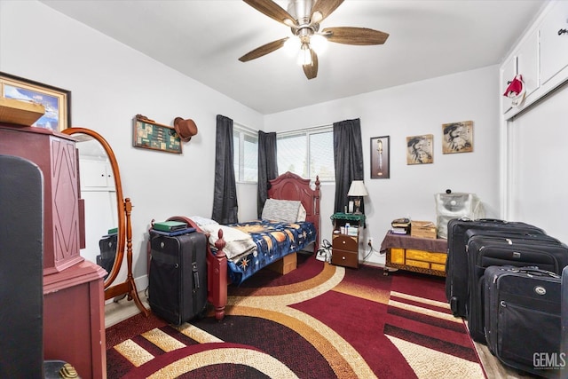 carpeted bedroom with a closet and ceiling fan