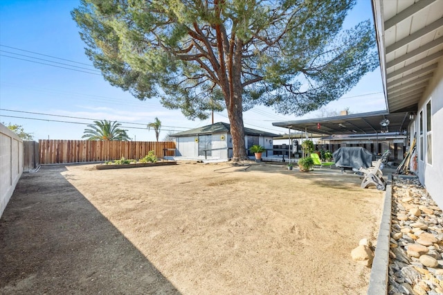 view of yard with a patio area and a storage shed