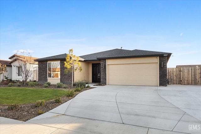 view of front of house with a front lawn and a garage