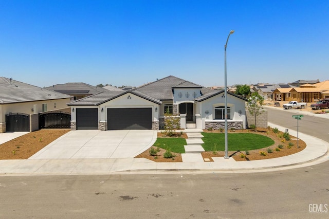 8708 Tamburlane Ct, Bakersfield, CA 93314 - view of front of property with a garage, a gate, stone siding, stucco siding, and driveway