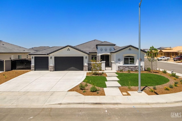 8708 Tamburlane Ct, Bakersfield, CA 93314 - view of front of property featuring a gate, a garage, concrete driveway, and stone siding