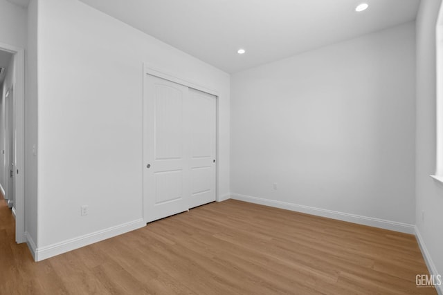 8708 Tamburlane Ct, Bakersfield, CA 93314 - unfurnished bedroom with light wood finished floors, recessed lighting, and a closet