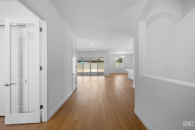 8708 Tamburlane Ct, Bakersfield, CA 93314 - hallway with wood finished floors and recessed lighting