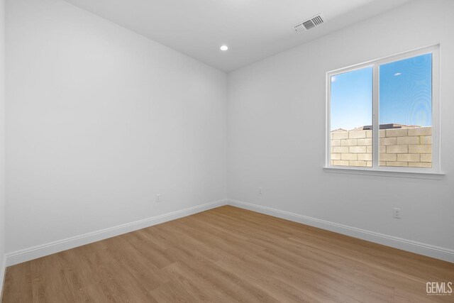 8708 Tamburlane Ct, Bakersfield, CA 93314 - empty room featuring light wood-style floors and recessed lighting