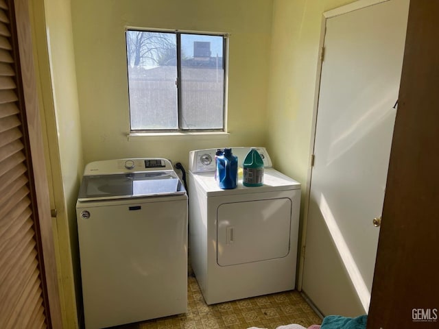 laundry area with independent washer and dryer