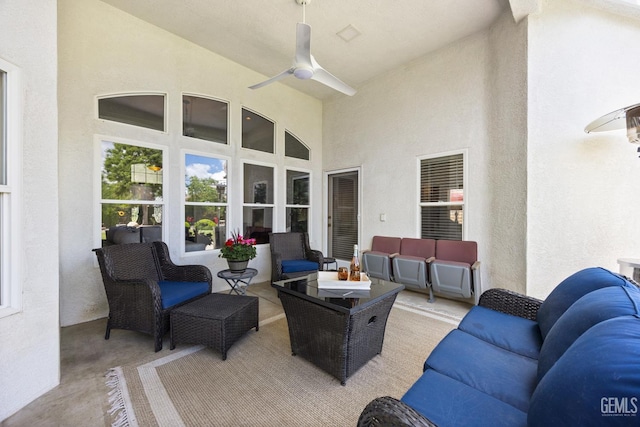 view of patio with outdoor lounge area and a ceiling fan