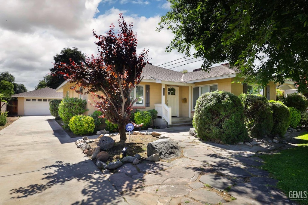 2424 C St, Bakersfield, CA 93301 - view of front of property with concrete driveway and a shingled roof