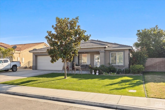 view of front of home featuring a front yard and a garage