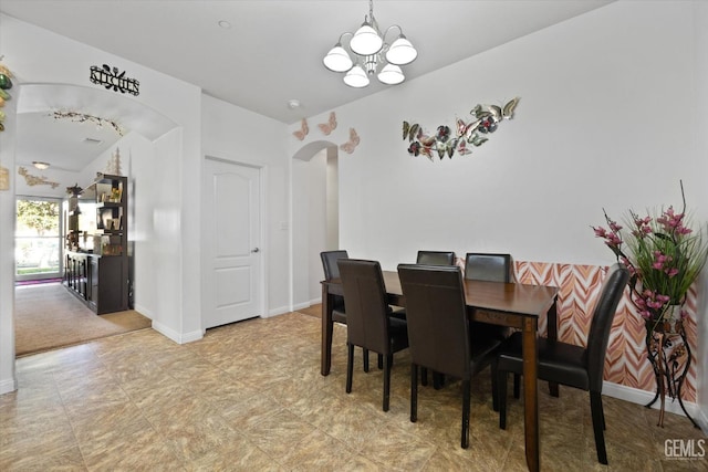 dining space with a chandelier