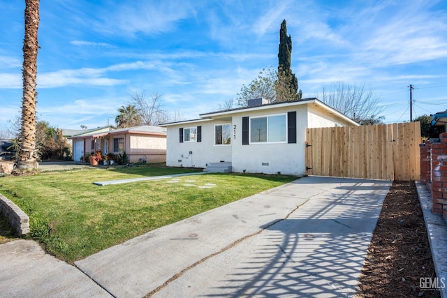 single story home featuring a garage and a front lawn