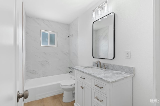 full bathroom featuring vanity, tiled shower / bath combo, toilet, and hardwood / wood-style flooring