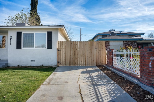 view of side of home featuring a yard