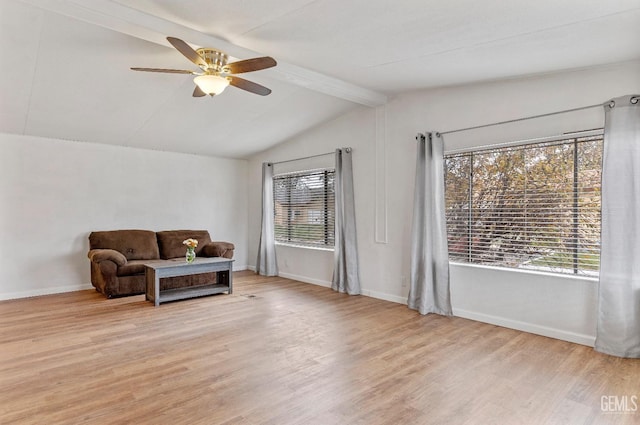 sitting room with vaulted ceiling with beams, ceiling fan, and light hardwood / wood-style flooring