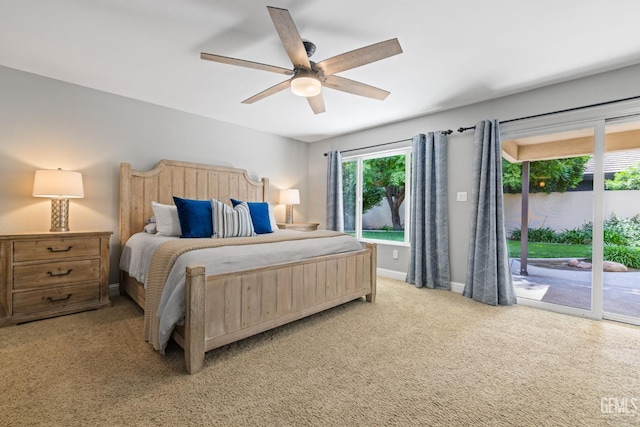 401 Via Carisma, Bakersfield, CA 93309 - bedroom featuring access to exterior, light colored carpet, baseboards, and a ceiling fan