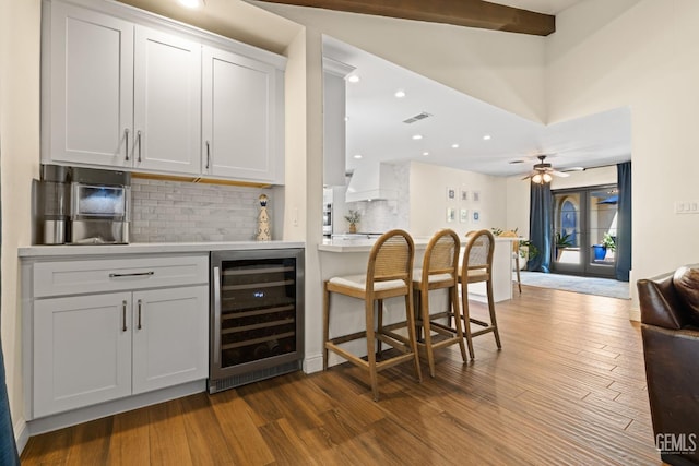 401 Via Carisma, Bakersfield, CA 93309 - indoor bar featuring wine cooler, tasteful backsplash, dark wood-style floors, ceiling fan, and recessed lighting