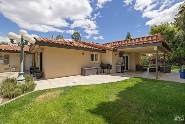 401 Via Carisma, Bakersfield, CA 93309 - back of property with a patio, a lawn, a tile roof, and stucco siding