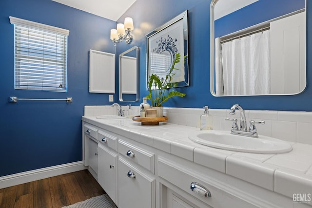 401 Via Carisma, Bakersfield, CA 93309 - bathroom featuring wood finished floors, baseboards, and double vanity