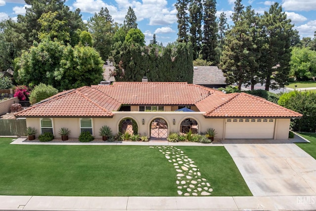 401 Via Carisma, Bakersfield, CA 93309 - mediterranean / spanish-style house featuring stucco siding, a garage, concrete driveway, and a tiled roof