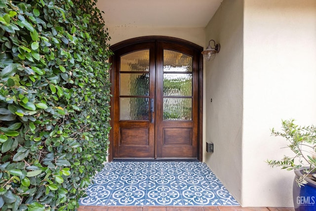 401 Via Carisma, Bakersfield, CA 93309 - view of exterior entry featuring stucco siding and french doors