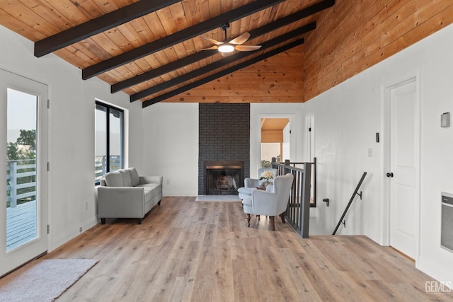24501 Pueblo Ct, Tehachapi, CA 93561 - living area featuring a wood ceiling with exposed beams, light wood-style flooring, a brick fireplace, ceiling fan, and high vaulted ceiling