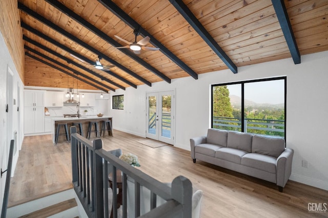24501 Pueblo Ct, Tehachapi, CA 93561 - living area with a wooden ceiling with exposed beams, light wood-style flooring, healthy amount of natural light, high vaulted ceiling, and a ceiling fan