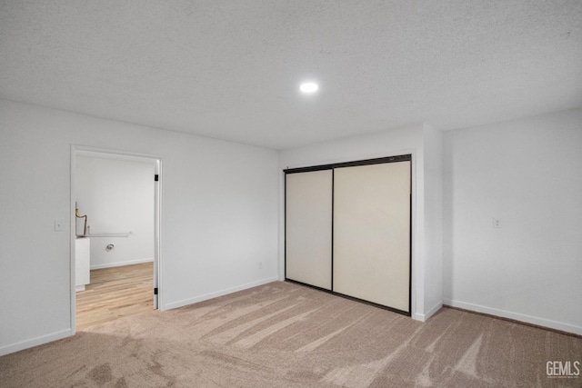 24501 Pueblo Ct, Tehachapi, CA 93561 - unfurnished bedroom with carpet, a closet, and recessed lighting